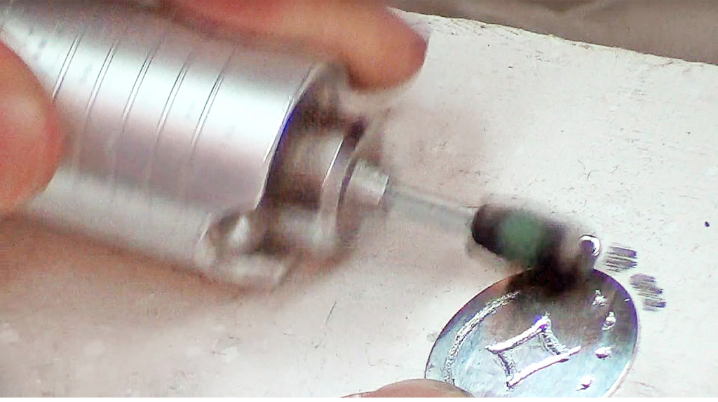 Polish out the rough edges from the piece. This can be done by hand, but its much easier with a motorized tool.